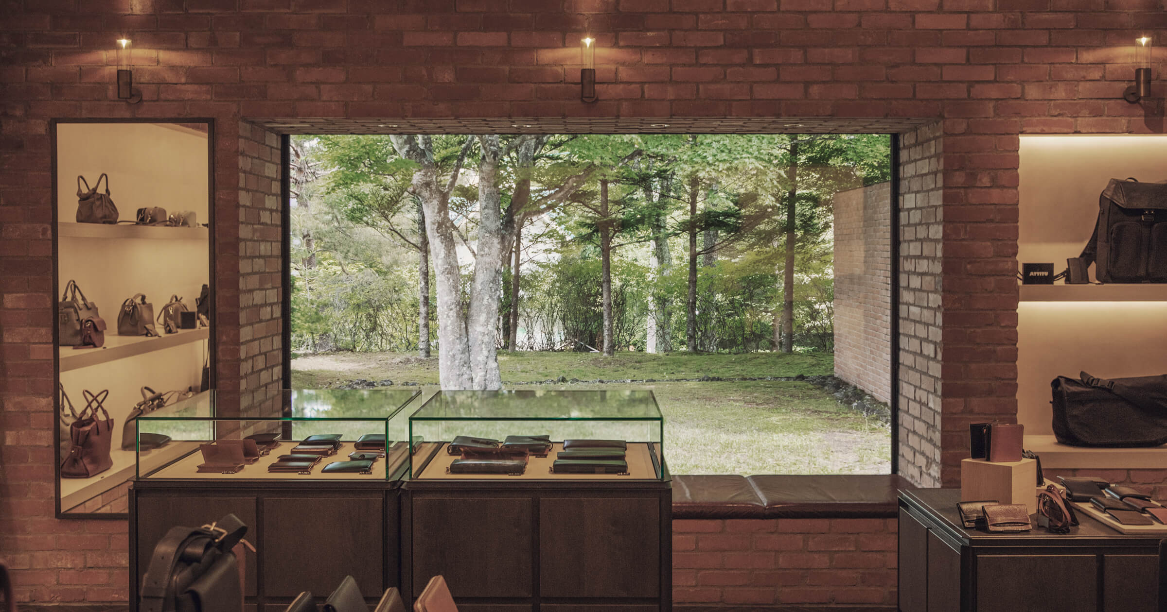 Interior of a shop with a view of trees outside.